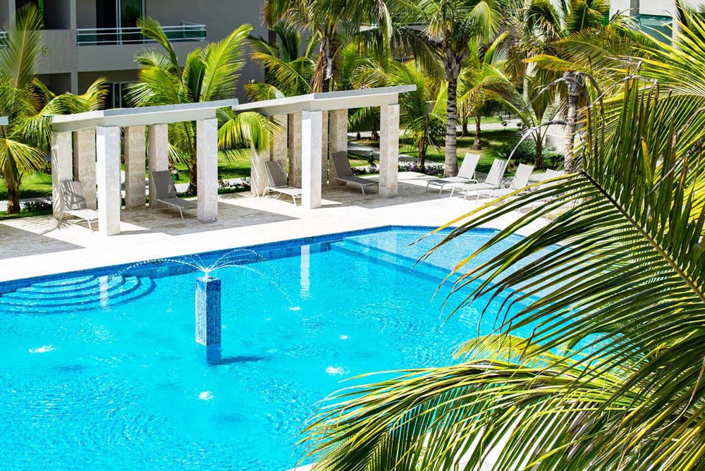 Pool with fountain at Beach Apartamentos at Playa Palmera